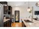 Contemporary kitchen featuring granite countertops, modern appliances, and hardwood floors at 2645 W 24Th Ave, Denver, CO 80211