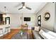 Cozy living area with a gray couch, modern rug, and a view into the open kitchen at 2645 W 24Th Ave, Denver, CO 80211