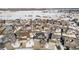 Aerial view of a quiet neighborhood with snow at 5907 E Tabor Pl, Castle Rock, CO 80104