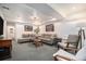 Spacious basement Gathering room with ample seating and natural light at 5907 E Tabor Pl, Castle Rock, CO 80104