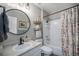 Charming bathroom with a shower/tub combo, a vanity, and decorative accents at 5907 E Tabor Pl, Castle Rock, CO 80104