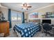 Cozy bedroom featuring a double bed, a desk, and built-in shelving at 5907 E Tabor Pl, Castle Rock, CO 80104