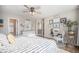 Well-lit bedroom with a comfortable bed, ceiling fan, and plenty of closet space at 5907 E Tabor Pl, Castle Rock, CO 80104