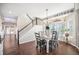 Bright dining area with hardwood floors and a charming farmhouse table at 5907 E Tabor Pl, Castle Rock, CO 80104