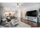 Spacious living room with hardwood floors, fireplace, and ample natural light at 5907 E Tabor Pl, Castle Rock, CO 80104