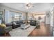 Spacious living room with hardwood floors, fireplace, and ample natural light at 5907 E Tabor Pl, Castle Rock, CO 80104