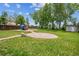 Spacious backyard featuring lush grass, mature trees, and a play area at 20338 E 48Th Dr, Denver, CO 80249