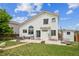 Spacious backyard with a patio, shed, grassy area, and fence at 20338 E 48Th Dr, Denver, CO 80249