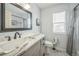 This bathroom features a modern sink, patterned tile, a bath/shower combo and a window at 20338 E 48Th Dr, Denver, CO 80249