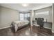 Comfortable bedroom with wood-look floors and lots of natural light at 20338 E 48Th Dr, Denver, CO 80249