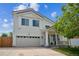A welcoming two-story home with a two-car garage and covered front porch at 20338 E 48Th Dr, Denver, CO 80249