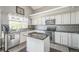 Well-equipped kitchen features stainless steel appliances, granite countertops, and a center island at 20338 E 48Th Dr, Denver, CO 80249