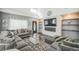 Inviting living room with large windows, plush seating, a fire place, and stylish decor at 20338 E 48Th Dr, Denver, CO 80249