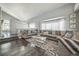 Inviting living room with large windows, plush seating, and stylish decor at 20338 E 48Th Dr, Denver, CO 80249