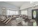 Inviting living room with large windows, plush seating, and stylish decor at 20338 E 48Th Dr, Denver, CO 80249