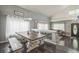 Open-concept living and dining area with seamless flow and lots of natural light at 20338 E 48Th Dr, Denver, CO 80249