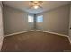 Bright and spacious bedroom with neutral gray paint and ample natural light at 921 Dakin St, Denver, CO 80221