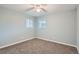Clean bedroom with gray walls and carpet, providing a blank canvas at 921 Dakin St, Denver, CO 80221