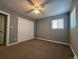 Spacious bedroom with ceiling fan, closet, and windows for natural light at 921 Dakin St, Denver, CO 80221