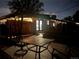 Cozy brick patio at night with outdoor seating and string lights, perfect for evening relaxation and entertaining at 921 Dakin St, Denver, CO 80221