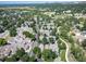 Scenic aerial view of a residential neighborhood with tree-lined streets, well-spaced homes, and a peaceful atmosphere at 7630 S Monaco Way, Centennial, CO 80112