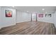 Spacious finished basement with sleek flooring, recessed lighting, and ample room for various activities at 7630 S Monaco Way, Centennial, CO 80112