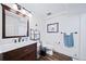 Bathroom featuring a modern vanity, stylish fixtures, and a toilet with a chrome rack at 7630 S Monaco Way, Centennial, CO 80112