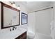 Bathroom featuring a modern vanity, stylish fixtures, and a shower-tub combination at 7630 S Monaco Way, Centennial, CO 80112