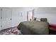 Bedroom featuring cozy decor, a comfortable bed, and a colorful rug over sleek flooring at 7630 S Monaco Way, Centennial, CO 80112