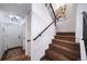 Light and bright entryway with carpeted stairs and black metal railing at 7630 S Monaco Way, Centennial, CO 80112