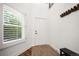 Bright foyer featuring decorative flooring, a storage bench, and white walls at 7630 S Monaco Way, Centennial, CO 80112