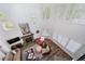Open living room with a fireplace, large windows, and hardwood floors at 7630 S Monaco Way, Centennial, CO 80112