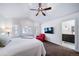 Bright main bedroom with natural light, a ceiling fan, and an ensuite bathroom at 7630 S Monaco Way, Centennial, CO 80112