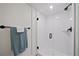 Modern tiled shower with glass enclosure, offering a clean and stylish design at 7630 S Monaco Way, Centennial, CO 80112