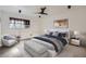 Serene bedroom featuring stylish furniture, neutral tones, a ceiling fan, and plenty of natural light at 4960 E Donald Ave # 11, Denver, CO 80222