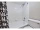 Clean bathroom with shower/tub combo and patterned shower curtain at 625 N Pennsylvania St # 108, Denver, CO 80203