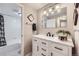 Modern bathroom with white vanity, quartz countertop, and updated fixtures at 625 N Pennsylvania St # 108, Denver, CO 80203