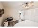 Bright bedroom with wood-look floors, ceiling fan, and built-in closet at 625 N Pennsylvania St # 108, Denver, CO 80203