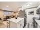 Open kitchen with stainless steel appliances and island at 625 N Pennsylvania St # 108, Denver, CO 80203
