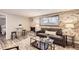 Spacious living room with a fireplace and view into bedroom at 625 N Pennsylvania St # 108, Denver, CO 80203