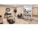 Bright living room with kitchen bar, modern furniture, and hardwood floors at 625 N Pennsylvania St # 108, Denver, CO 80203
