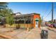 Brightly colored restaurant exterior with outdoor seating and a turquoise door at 625 N Pennsylvania St # 108, Denver, CO 80203