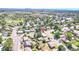 An aerial view of neighborhood homes, showcasing the property's location with mature trees at 8030 Ogden St, Denver, CO 80229