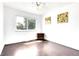 Bedroom featuring hardwood floors, ceiling fan, wall art, large window providing great natural light at 8030 Ogden St, Denver, CO 80229