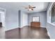 Bedroom featuring hardwood floors, ceiling fan, double closet, dresser, and bright window at 8030 Ogden St, Denver, CO 80229