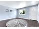 Bright and airy living room with a neutral color palette and large window at 8030 Ogden St, Denver, CO 80229