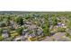 Residential area featuring well-maintained homes among mature trees, highlighting a peaceful community setting near open water at 4501 Zenobia St, Denver, CO 80212
