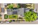 Home with manicured backyard featuring a patio set and mature tree coverage, showcasing a tranquil outdoor living space at 4501 Zenobia St, Denver, CO 80212