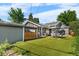 Spacious backyard features artificial grass, outdoor seating, and privacy fencing at 4501 Zenobia St, Denver, CO 80212