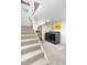 Finished basement with new washer and dryer and neutral carpeted stairs at 4501 Zenobia St, Denver, CO 80212
